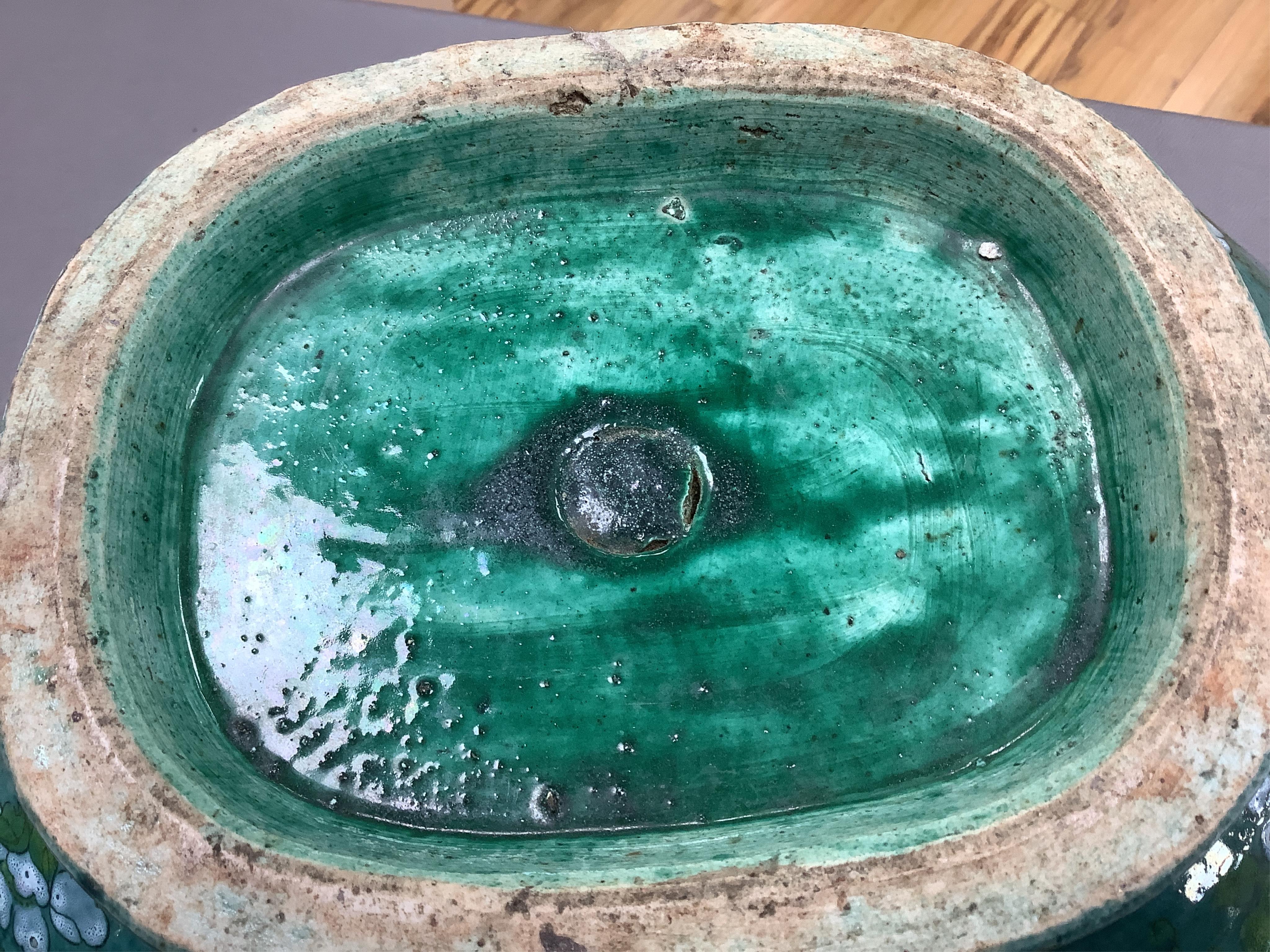 A Chinese enamelled porcelain oval bowl, Guandong kilns, early 20th century, green with en grisaille panels, 20cm high
